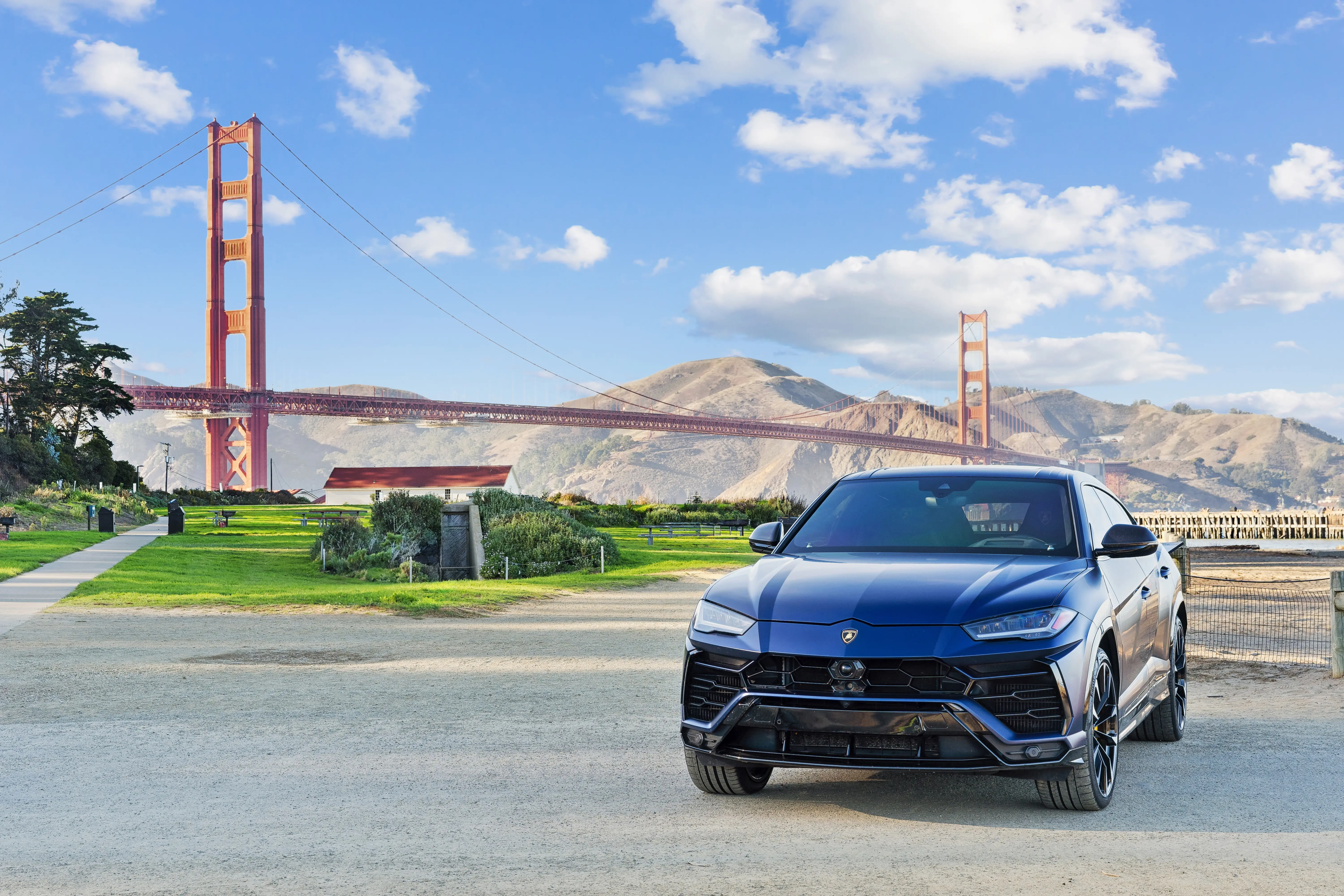 Matte blue Lamborghini Urus detailed at the Golden Gate Bridge
